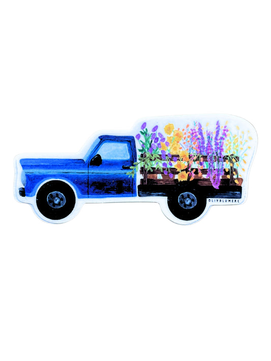 vinyl sticker of cottagecore-style blue pickup truck with flowers.